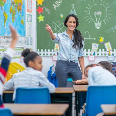 Teacher engaging a classroom of pupils
